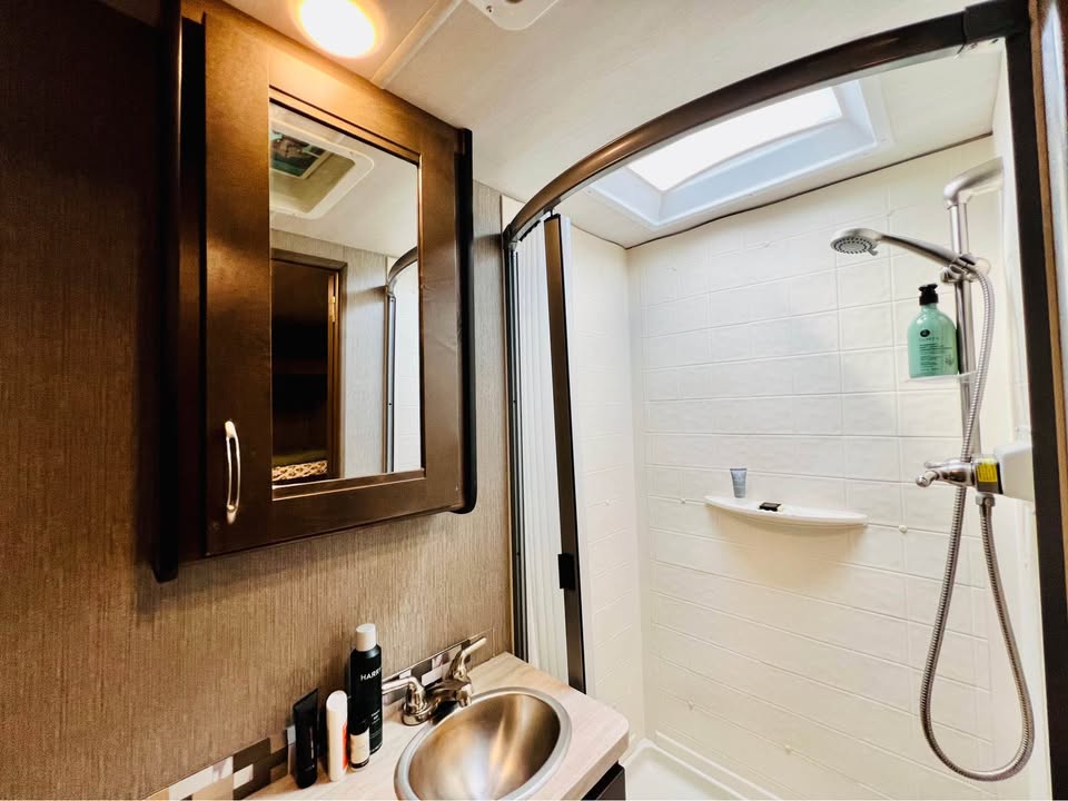 Bathroom with shower and skylight